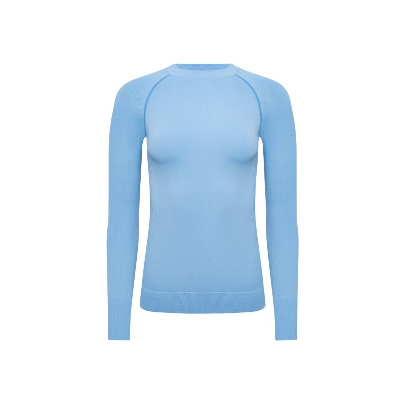 The Halfdays Johnson Top is a light blue, long-sleeve, form-fitting sweater crafted as a nylon seamless base layer, ideal for an active outdoor fit against a white background.