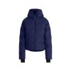 The Georgie Puffer Jacket by Halfdays is a navy blue ski jacket featuring a hood, front zipper, and cuffs, optimized for mountain performance, shown against a white backdrop.