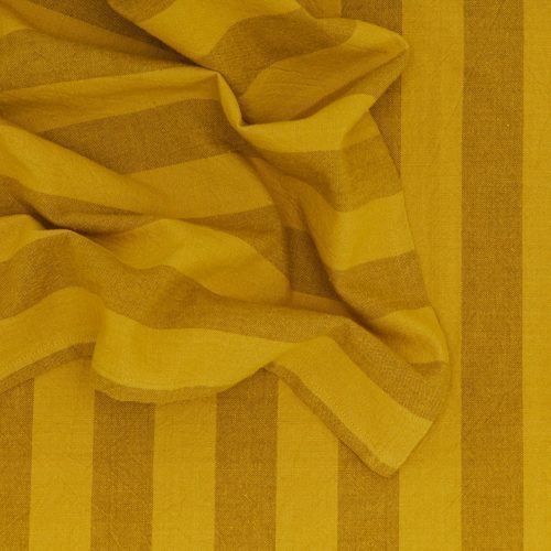 Close-up of crumpled fabric with mustard-yellow wide and narrow stripes, ideal for Hawkins New York's Essential Striped Dinner Napkins (Set of 4).