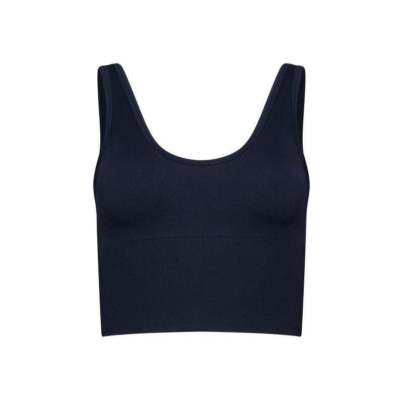 Front view of the Marie Top by Halfdays, a black sleeveless crop with a scoop neckline against a white background, made from performance nylon for engineered compression.