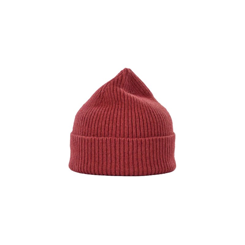 A lambswool beanie by Le Bonnet in red, showcasing a ribbed knit design and a folded brim.