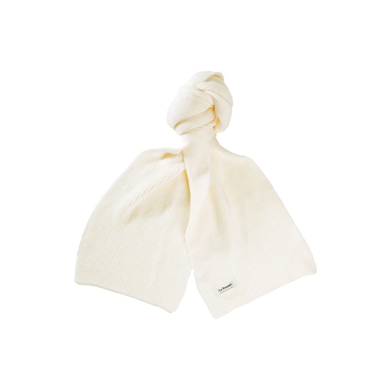 A cream-colored knitted lambswool scarf from Le Bonnet, featuring a visible label, tied in a knot on a plain white background.